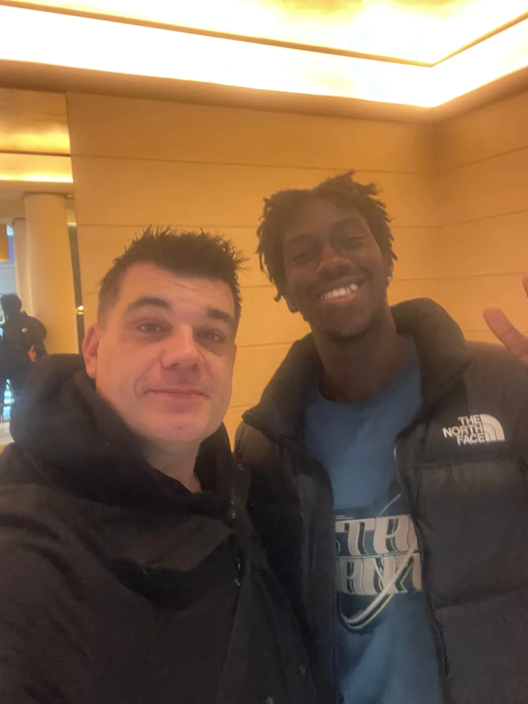Jean Pierre Ciesielski with a professional athlete while traveling